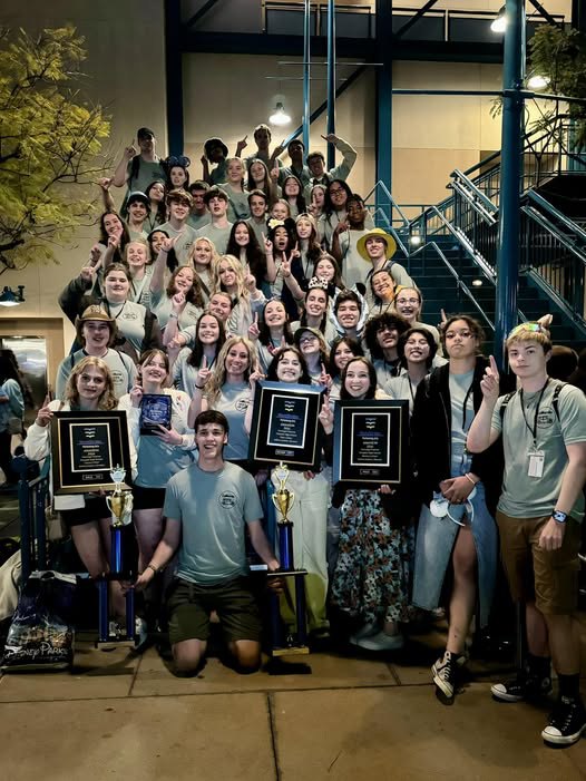 Mustang Choir with trophies and awards
